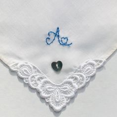 "You will buy a pretty new and unused, upcycled vintage,  white cotton, hand embroidered hankie. This delightful gift is monogrammed with the letter \"A\". This handkerchief would make an ideal \"Something Old, New & Blue\" gift to give to a bride to be with the initial \"A\" on her special day. I have monogrammed this Fisba Stoffels new, vintage handkerchief with the initial \"A\" in one corner with hand embroidery using blue thread. The handkerchief also depicts a pretty whitework floral motif Vintage Blue Handkerchiefs For Wedding, Vintage Blue Wedding Handkerchiefs, Blue Vintage Wedding Handkerchiefs, Handmade White Wedding Handkerchiefs, Blue Cotton Handkerchiefs For Wedding, Diy Handkerchief, Monogrammed Handkerchiefs, Initial A, The Letter A