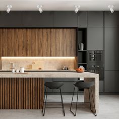 a modern kitchen with marble counter tops and wooden cabinets, along with bar stools