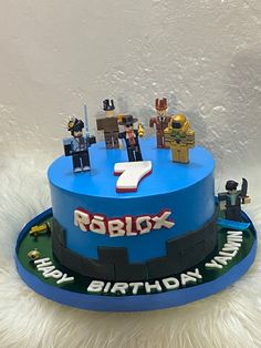 a birthday cake with lego figures on it