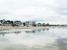 houses on the beach with water reflecting them