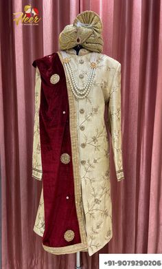 This sherwani includes Sherwani, Pajama/Pajami/Pant, Necklace, Dupatta. For any assistance, Whatsapp us at +91-9079290206 or mail us at heersuhaagchura4@gmail.com Traditional Drape Raw Silk Sherwani With Zari Work, Traditional Raw Silk Sherwani With Zari Work, Kundan Sherwani For Eid Festivities, Traditional Gold Sherwani With Traditional Drape, Traditional Gold Sherwani With Drape, Embroidered Kundan Sherwani For Eid, Gold Sherwani With Traditional Drape For Transitional Season, Festive Bollywood Sherwani With Kundan, Transitional Gold Sherwani With Traditional Drape