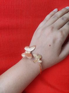 Who can say no to a beautiful butterfly bracelet? Grab our unique Butterfly Cuff Bracelet in Gold Plating. A perfect choice for any outfit, party, or casual, and an ideal choice for a beautiful gift for her. Details: Brass Metal Gold Plated Adjustable Cuff Bracelet Hypoallergenic Butterfly Design *Do not use alcohol, sanitizers or perfumes near the jewelry. Butterfly Clasp Bracelets For Gift, Elegant Party Bracelets With Butterfly Charm, Elegant Butterfly Charm Bracelets For Parties, Silver Bracelets With Butterfly Charm For Party, Elegant Butterfly Charm Bracelet For Parties, Elegant Butterfly Bracelets For Gift, Elegant Butterfly Bracelets For Gifts, Butterfly Charm Party Bracelet Jewelry, Adjustable Bracelet With Butterfly Clasp As Gift