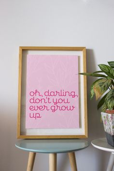 a pink framed print with the words, if dancing don't you ever grow up