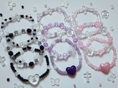 ❅❆For guaranteed delivery by Christmas please order before December 12th ♥Sweet Wishes ~ 3 Bracelet Set ~♥ ❀Set includes 3 different bracelets in your choice of Black, Purple, or Pink ❀Handmade with a mix of plastic, acrylic, and glass beads on clear stretch cord ❀All bracelets are approx. 7 inches in size ❀Cute for wearing on your wrist or putting in a ring binder!  ❀Crafted in a pet free and smoke free environment ♥Want a custom bracelet or a different size? Please send me a message or request a custom order!♥ ♥My shop offers flat rate shipping for all the items in your order, and free shipping if you spend $35 Black Pink Bracelet, Pink And Purple Beaded Bracelet, Friendship Bracelets Flat Beads, Pink And Purple Bracelet, Purple Bracelet Ideas, Rice Bead Bracelet, Kawaii Bracelet, Purple Beaded Bracelets, Beading For Kids