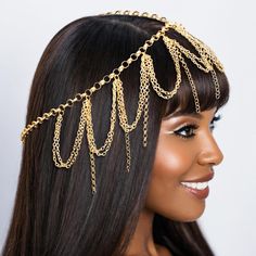 Women's Head Chain. Gold Metal Head Chain Featuring Draped and Drop Chain Detailing. Worn on Top of Head. Drop Chain Details measure 3.15". Lobster Clasp Closure.