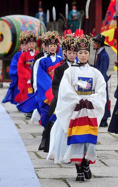 a group of people in costume walking down a street