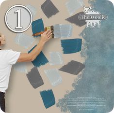 a man is painting the wall with blue and gray paint on it's walls