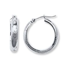 A diamond-cut pattern etched into 14K white gold enhances these versatile hoop earrings for her. The earrings secure with hinged backs. White Gold Hypoallergenic Hoop Earrings For Anniversary, Anniversary White Gold Hypoallergenic Hoop Earrings, Anniversary Hinged Huggie Hoop Earrings, Silver Round Diamond Cut Hoop Earrings, Elegant Engraved Small Hoop Earrings, White Gold Hoop Pierced Jewelry, White Gold Hoop Pierced Earrings, White Gold Pierced Hoop Jewelry, Sterling Silver Hoop Earrings With Diamond Cut For Anniversary