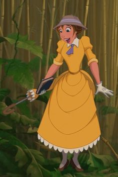 a woman in a yellow dress and hat holding two arrows while standing in front of bamboo trees