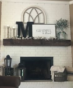 a fireplace mantle with a sign above it