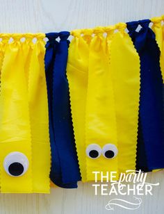 some yellow and blue paper bags with googly eyes