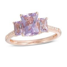 A classic look in romantic color, this gemstone and diamond ring is a stunning accessory she'll wear with everything. Crafted in 14K rose gold, this bold three-stone design showcases a trio of emerald-cut soft-purple Rose de France amethyst - the largest the 8.0 x 6.0mm center stone - each wrapped in a diamond-touched setting. Diamonds line the shank and gallery for an added hint of shimmer. Radiant with 1/6 ct. t.w. of diamonds and a brilliant buffed luster, this choice offers eye-catching styl Luxury 14k Rose Gold Diamond Ring, Elegant Rose Gold Diamond Ring With Accent Stones, Elegant Rose Gold Amethyst Ring With Center Stone, Classic 14k Rose Gold Rings With Accent Stones, 14k Rose Gold Rings With Accent Stones, Elegant Pink Three Stone Rings, Elegant Rose Gold Amethyst Ring, Timeless 14k Rose Gold Rings With Diamond Accents, Formal Three Stone Rose Gold Ring