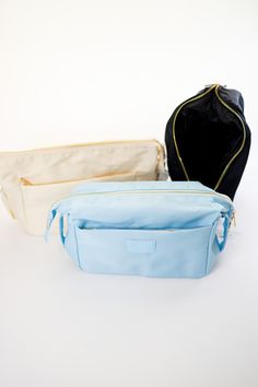 Made of Nylon Approximately 9.5 x 4.5 x 6.3 inches Gold Hardware Outer pocket Cosmetic Bum Bag, Cosmetic Pouch, Makeup Pouch, Travel • Made in United States Travel Makeup Bag, Pouch Makeup, White Denim Shorts, Graphic Tops, Bum Bag, Makeup Bags Travel, Makeup Pouch, Travel Makeup, Cosmetic Pouch