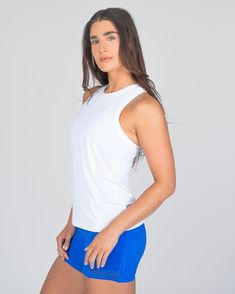 Designed in the same breathable fabric as our best-selling Laser Cut Pullover, this full-length tank is tailored to flatter with a body-slimming fit. It features intricate laser cut details throughout, enhancing ventilation to keep you cool and comfortable during intense workouts. Ideal for those who prefer extra coverage, this tank ensures you feel secure and stylish whether you're powering through a cardio session or mastering yoga poses. It's the perfect choice for active women seeking a blen White Compression Top With Built-in Bra, Athleisure Fitted Tank Top With Light Support, Fitted Light Support Tank Top For Athleisure, White High Stretch Sleeveless Tank Top, White Compressive Racerback Tank Top, White Stretch Top With Mesh Back, Breathable Fitted Racerback Tank Top, Fitted Breathable Racerback Tank Top, Fitted Activewear With Mesh Back For Spring