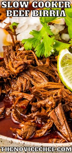 slow cooker beef with cilantro and lime garnish in a bowl