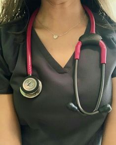 a woman with a stethoscope on her neck