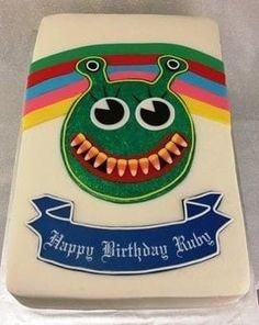 a birthday cake with an image of a green monster on it's face and the words happy birthday ruby