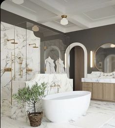 a bathroom with marble walls and flooring, white bathtub next to a plant