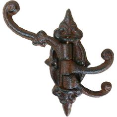 an ornate iron hook on a white background