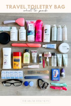 the contents of a travel toiletry bag laid out on a table