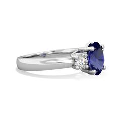 This 14K White Gold trellis three stone ring features an {shape} vivid blue lab sapphire, flanked by {diamondcarats}. A trellis ring features gorgeous interwoven prongs holding the lab sapphires that symbolize the union of marriage and the wonderful journey you two will embark on together for the rest of your lives. Luxury White Gold Lab-created Sapphire Wedding Ring, Luxury White Gold Lab-created Sapphire Ring, Clean Origin, Sapphire Jewelry, Three Stone Rings, Sapphire Diamond, Three Stone, Stone Rings, Sapphire Ring