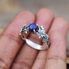 Silver Floral Ring, Lapis Lazuli Ring, Celestial Ring, 925 Sterling Silver Ring, Handmade Ring, Weeding Ring, Anniversary Gift For Her 》D E T A I L S《 Gemstone: Natural Lapis Lazuli Gem Color: Blue Stone Shape: Round Metal: 925 Sterling Silver Purity: 925 Parts Per 1000 Setting Type: Prong Set Silver Polish: High Ring Size: All Size Available Please note that there Can be slight variations in stone texture and color shades in the actual product that you receive. The stone quality or grade will b Blue Gem Ring, Lily Ring, Celestial Ring, Lapis Lazuli Jewelry, Lapis Ring, Silver Polish, Lapis Lazuli Ring, Floral Ring, Stone Texture