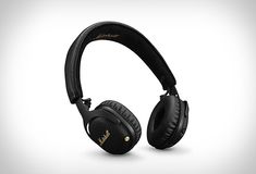 the marshall headphones are black and have gold lettering on them, while they're closed