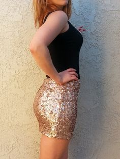 The color is a beautiful rose gold, like a champagne. Very classy and elegant. This skirt is comfortable and fun to wear. A personal favorite :)   - Stretchy. Especially the waist. - FULL Front & back sequins. - Lined, Makes an impression!   SIZING: Length approx 16 inches. Stretchy waist. Runs small.  XS/S - 35-37fullest hip (00-0) S/M - 37-39 fullest hip (2-4) sold out M/L - 40-41 fullest hip (6-8) L/XL - 42-44 fullest hip (10-12) ********************************* Will ship in 1 to 2 days!... Sequined Club Bottoms For Party Season, Sequin Bottoms For Club And Party Season, Glamorous Stretch Skirt For Club, Sequin Stretch Mini Skirt For Club, Sequined Stretch Mini Skirt For Club, Glamorous Club Skirt With Stretch, Stretch Sequin Mini Skirt For Club, Glamorous Contrast Sequin Bottoms For Club, Stretch Sequin Mini Skirt For Party Season