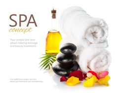 spa concept with towels and flowers on white background