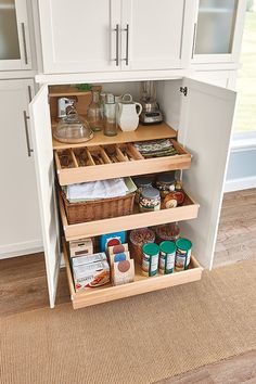 an organized pantry in the corner of a kitchen