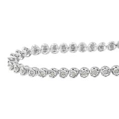 Feminine yet glamorous, this tennis bracelet shines in a polished sterling silver setting. Each link of this tennis diamond bracelet holds a beautiful rose-cut diamond to create a seamless look. Give her this bracelet for a unique and elegant gift she'll remember forever. Rose-cut, promo quality diamonds are milky and cloudy in nature. They have an asymmetrical ball shape and are filled with inclusions. These are on the lowest end of the diamond quality scale. Cloudy Nature, Bracelet Tennis, Rose Cut Diamond, Tennis Bracelet, Quality Diamonds, 1 Carat, Elegant Gift, Beautiful Roses, Diamond Gemstone