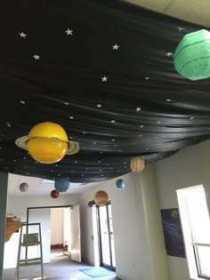 the ceiling is decorated with planets and stars