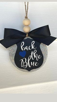 a door hanger that says back to the blue with a mickey ears on it