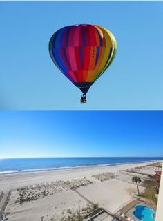 two hot air balloons flying over the beach