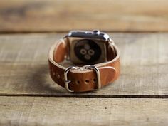 Apple Watch Band 38mm Women | Handmade in the USA | Horween Leather English Tan - Medium Brown | Loo Handmade Brown Adjustable Watch, Handmade Adjustable Brown Watch, Vintage Handmade Adjustable Watch Accessories, Handmade Vintage Watches, Handmade Vintage Watches For Everyday, Vintage Handmade Watches For Everyday Use, Leather Apple Watch Band Perfect As A Gift, Handmade Vintage Watches For Everyday Use, Leather Watch Band With Palladium Hardware As Gift