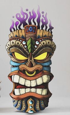 an image of a tiki mask with fire coming out of it's mouth