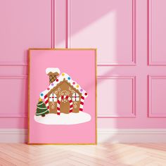 a pink wall with a gingerbread house on it