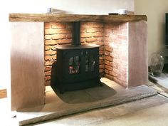 a wood burning stove sitting inside of a living room