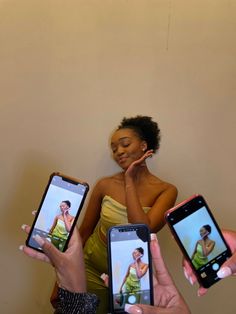 three women holding up their cell phones to show them how they are doing something on the screen