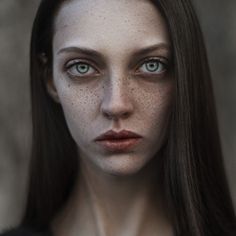 a woman with freckles on her face is shown in the instagramr