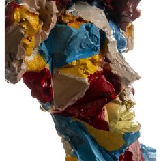 a close up of a sculpture made out of different colored paint and paper machs