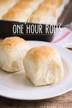 one hour rolls on a white plate next to a baking pan with bread in it