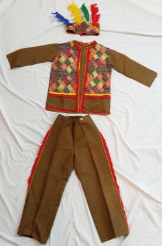 a child's native american outfit with feathers on it