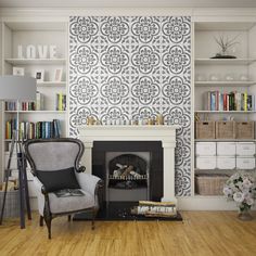 a living room with a fireplace and bookshelves on the wall next to it