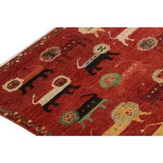 a red rug with animals on it