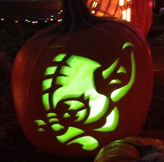 a carved pumpkin with an image of a tiger on it