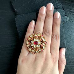 *It's One of a kind Antique Statement Kundan Wedding Ring.Gold Plated Handmade Kundan Jewelry for Indian and Pakistani Brides. *It's made from Silver and Copper with White and Pink Kundan Stones Settings & 22k gold Plating as shown in picture. *It's beautiful Ethnic 2 Inch Round Unique Bridal Ring. *It's Adjustable and fit for all size. *Our all jewelry is made from semiprecious stones and beads. *WARRANTY: ITS GENUINE HANDMADE JEWELRY AND WE ARE GIVING LONG LIFE WARRANTY FOR OUR ALL ITEMS. All Kundan Jadau Ring, Rajasthani Jewellery Royal, South Indian Wedding Jewelry, Polki Rings, Kundan Rings, Victorian Rings Vintage, Vintage Bridal Ring, Kundan Ring, Indian Ring