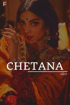 a woman in an orange outfit with the words chettana on her face and hands