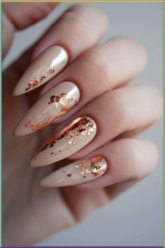 Whether you're looking for minimalist designs or daring colors, get inspired and start your year off with amazing New Year's nails. Autumn Nails With Glitter, Nails Taupe Design, Nails With Foil Art, Fall Nails Ideas Autumn Glitter, Foil Fall Nails, Autumn Sparkle Nails, Nail Ideas For Fall Autumn, Nails Design Fall 2024, Fall Foil Nail Designs