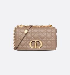 The Dior Caro bag combines modernity with timeless elegance. The silhouette is crafted in warm taupe supple calfskin with Cannage stitching. The bag features a flap adorned with an antique gold-finish metal CD twist clasp, inspired by the seal of a Christian Dior perfume bottle. The detachable chain shoulder strap with CD signature links allows the medium bag to be carried by hand, worn over the shoulder or crossbody, and may be replaced by one of the House's wide embroidered straps for day or e Dior Caro Bag, Dior Perfume Bottle, Dior Caro, Christian Dior Perfume, Warm Taupe, Dior Perfume, Womens Designer Bags, Bag Women Fashion, Military Inspired